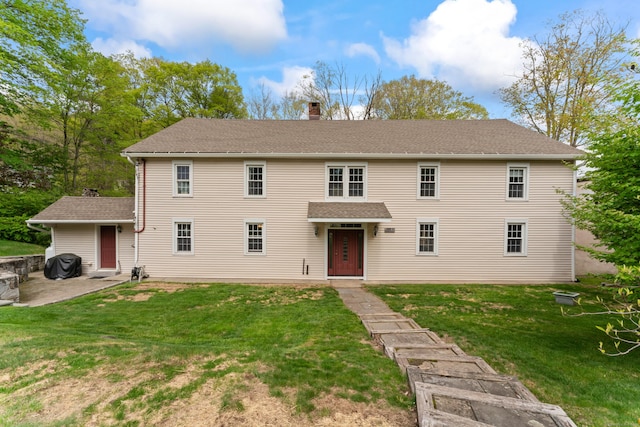 11 Glen Rd, Newtown, CT 06482 - colonial home featuring a front yard, a patio area, and a chimney