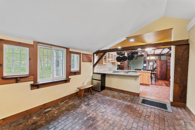 11 Glen Rd, Newtown, CT 06482 - kitchen featuring baseboards, freestanding refrigerator, a peninsula, vaulted ceiling, and light countertops