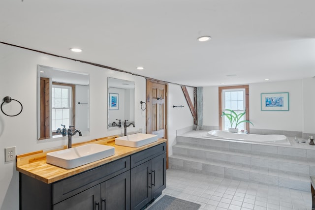 11 Glen Rd, Newtown, CT 06482 - full bath featuring a garden tub, double vanity, tile patterned flooring, and recessed lighting
