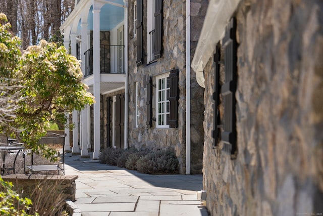 doorway to property featuring stone siding