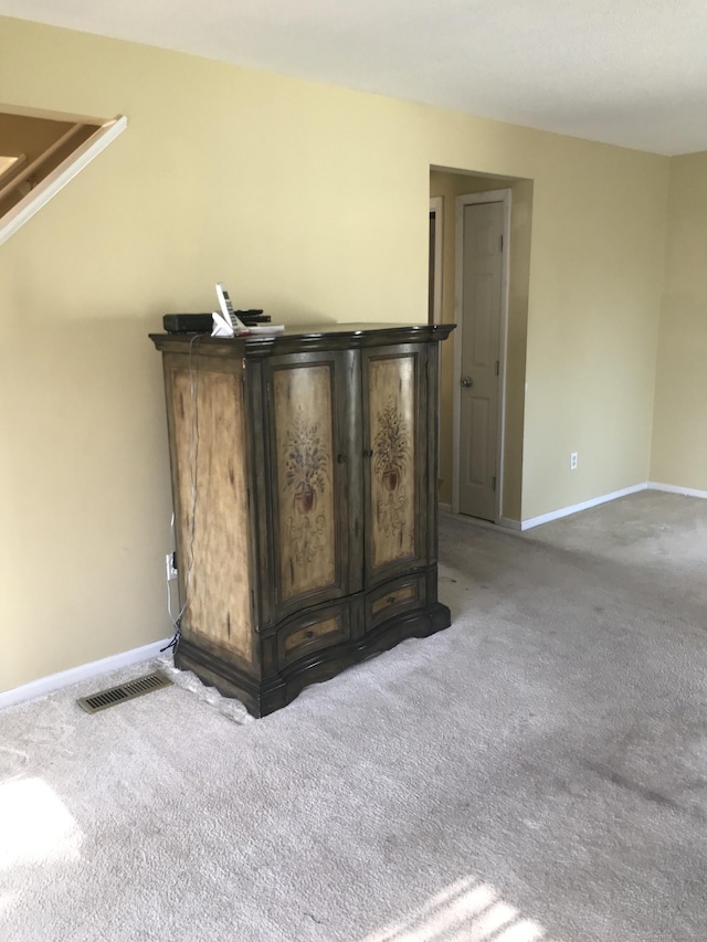 details with visible vents, baseboards, and carpet