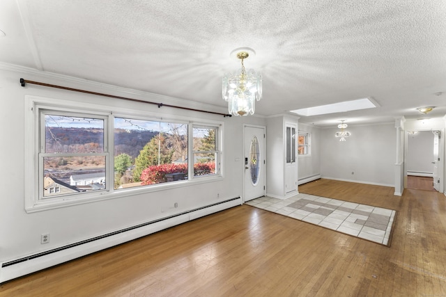 57 Bellevue Ter, Seymour, CT 06483 - interior space with a baseboard radiator, a notable chandelier, and baseboard heating
