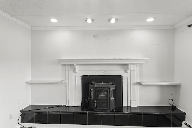 57 Bellevue Ter, Seymour, CT 06483 - details featuring baseboard heating, crown molding, a wood stove, and baseboards