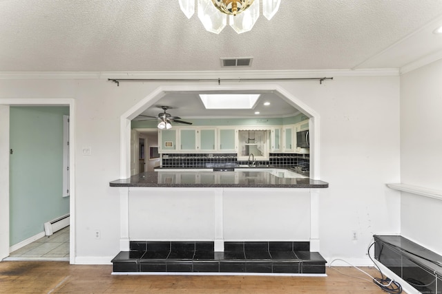 57 Bellevue Ter, Seymour, CT 06483 - kitchen with a sink, ornamental molding, and wood finished floors