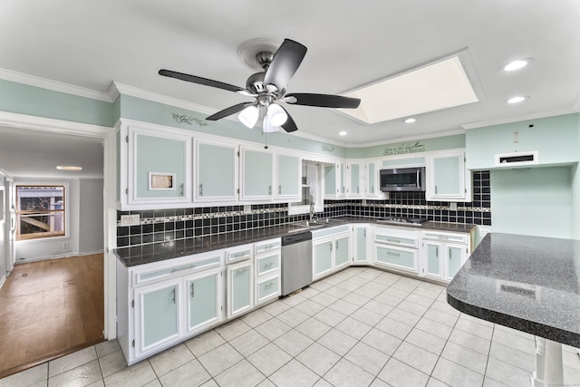 57 Bellevue Ter, Seymour, CT 06483 - kitchen with ornamental molding, recessed lighting, dark countertops, stainless steel appliances, and decorative backsplash