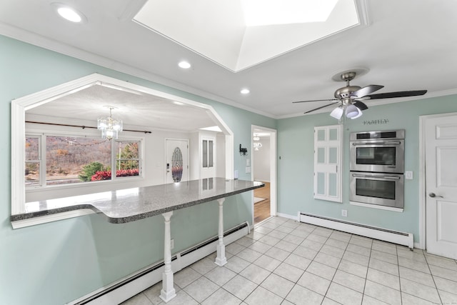 57 Bellevue Ter, Seymour, CT 06483 - kitchen with crown molding, double oven, recessed lighting, and baseboard heating