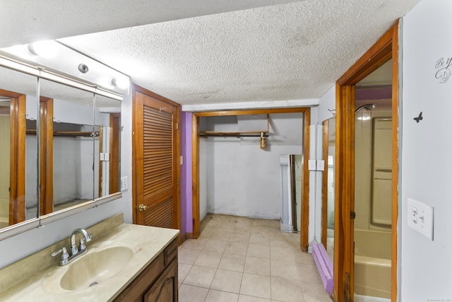 57 Bellevue Ter, Seymour, CT 06483 - full bathroom featuring tile patterned floors, vanity, a textured ceiling, and a bath