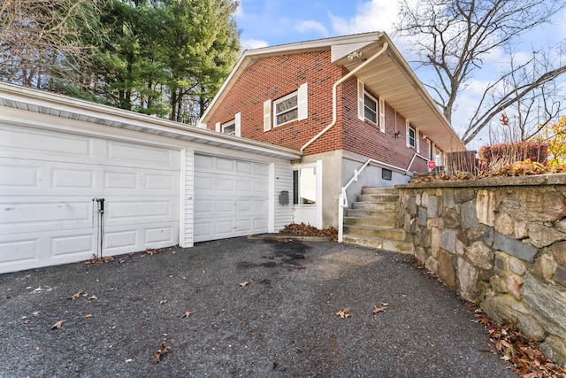 57 Bellevue Ter, Seymour, CT 06483 - view of home's exterior with brick siding, driveway, and a garage