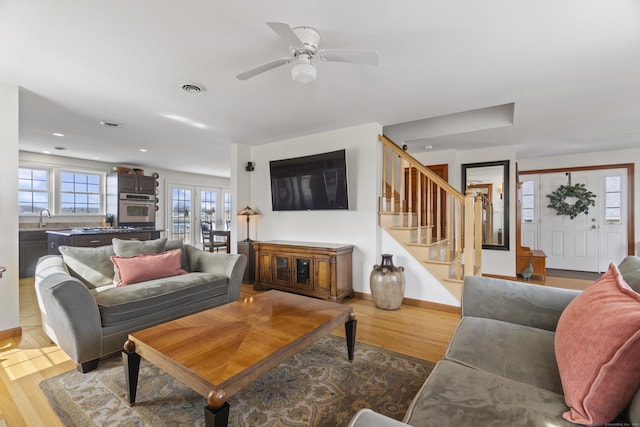 15 Buckingham Ave, Old Saybrook, CT 06475 - living room with wood finished floors, stairway, a ceiling fan, and recessed lighting