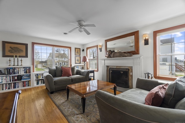15 Buckingham Ave, Old Saybrook, CT 06475 - living room featuring ceiling fan, a high end fireplace, and hardwood / wood-style floors