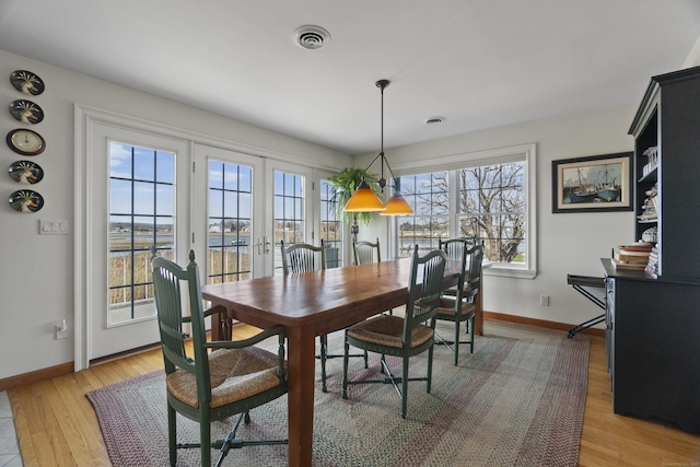 15 Buckingham Ave, Old Saybrook, CT 06475 - dining area featuring french doors and light wood-style floors