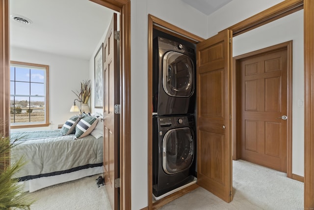 15 Buckingham Ave, Old Saybrook, CT 06475 - washroom with stacked washer and clothes dryer and light colored carpet