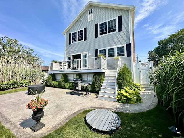 15 Buckingham Ave, Old Saybrook, CT 06475 - back of house featuring a patio area, a gate, stairs, and a wooden deck