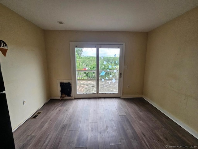 205 Flanders Rd, East Lyme, CT 06357 - spare room with dark wood-style flooring and baseboards