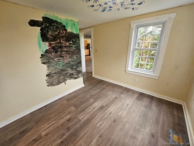 205 Flanders Rd, East Lyme, CT 06357 - spare room with wood finished floors and baseboards