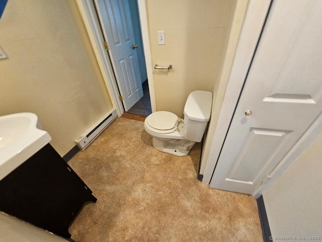 205 Flanders Rd, East Lyme, CT 06357 - bathroom with baseboard heating, toilet, vanity, and baseboards