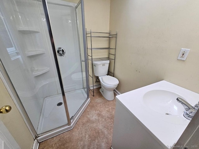 205 Flanders Rd, East Lyme, CT 06357 - bathroom with a stall shower, vanity, and toilet