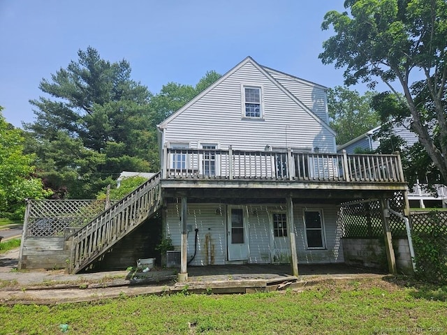205 Flanders Rd, East Lyme, CT 06357 - rear view of house featuring a wooden deck and stairway