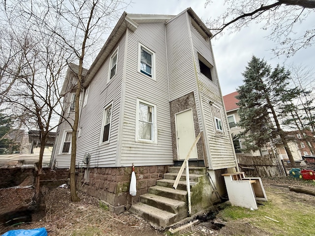back of house with fence