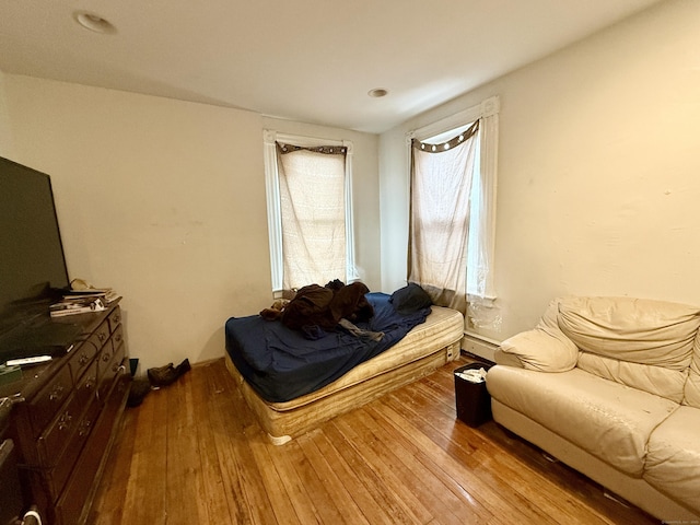 bedroom with wood finished floors