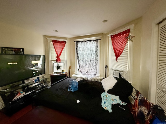 bedroom featuring radiator