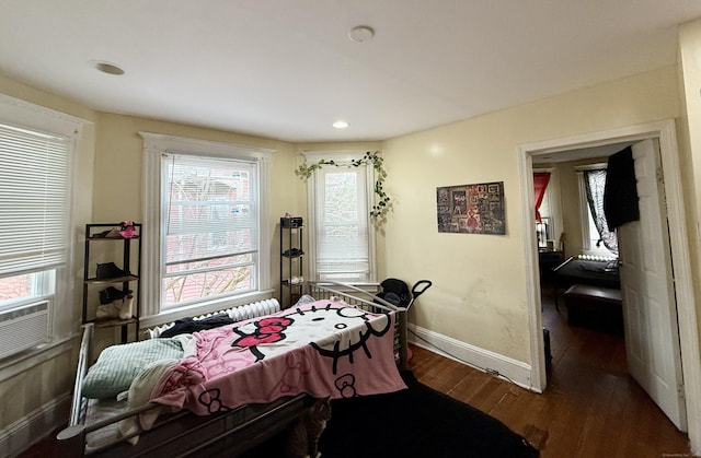 interior space with wood finished floors, baseboards, and recessed lighting