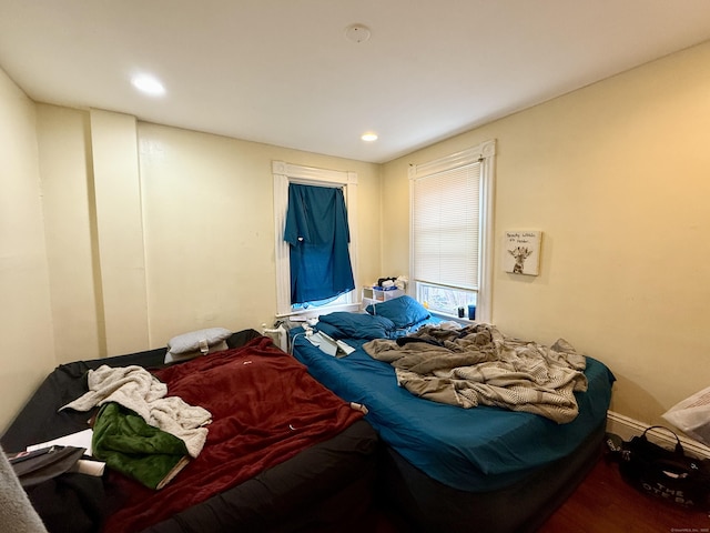 bedroom featuring recessed lighting and wood finished floors