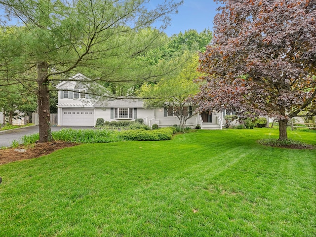 8 Argentine Way, Norwalk, CT 06850 - view of front facade with asphalt driveway, an attached garage, and a front yard