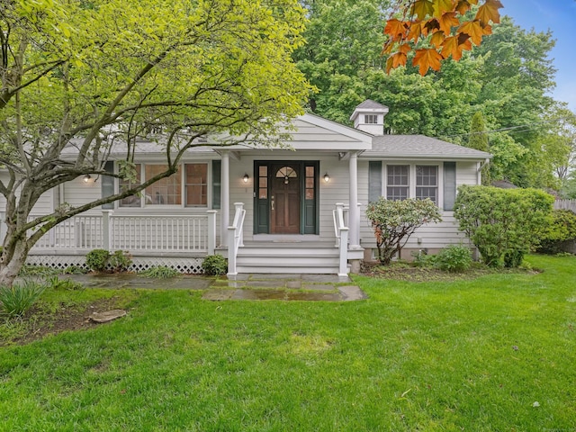 8 Argentine Way, Norwalk, CT 06850 - view of front of home featuring a front yard, covered porch, and roof with shingles