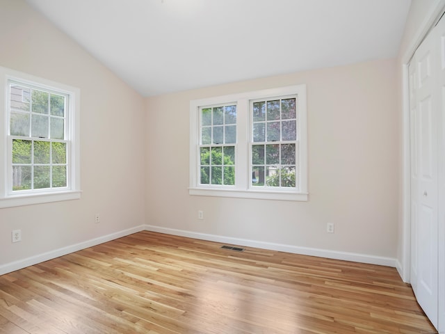 8 Argentine Way, Norwalk, CT 06850 - unfurnished bedroom with vaulted ceiling, a closet, light wood-style flooring, and baseboards