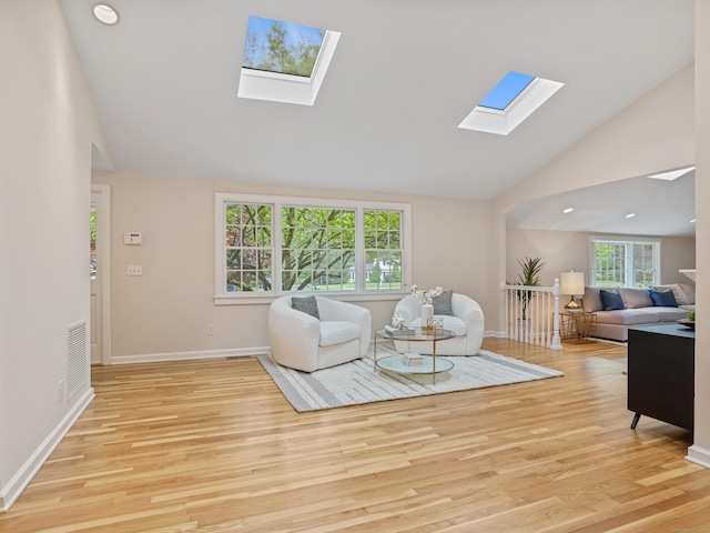8 Argentine Way, Norwalk, CT 06850 - living room with a skylight, wood finished floors, high vaulted ceiling, and baseboards