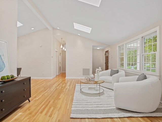 8 Argentine Way, Norwalk, CT 06850 - living room with a skylight, light wood finished floors, and baseboards