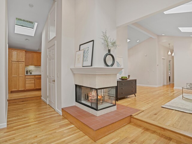 8 Argentine Way, Norwalk, CT 06850 - hallway featuring a skylight, light wood finished floors, high vaulted ceiling, and beamed ceiling