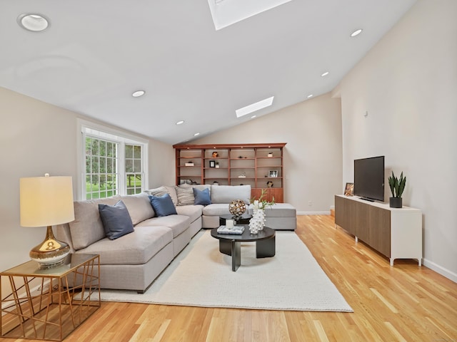 8 Argentine Way, Norwalk, CT 06850 - living room featuring a skylight, vaulted ceiling, light wood finished floors, baseboards, and recessed lighting