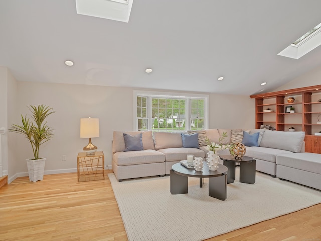 8 Argentine Way, Norwalk, CT 06850 - living area with a skylight, wood finished floors, recessed lighting, lofted ceiling, and baseboards