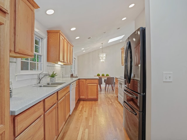 8 Argentine Way, Norwalk, CT 06850 - kitchen featuring freestanding refrigerator, a peninsula, a sink, dishwasher, and light wood-style floors