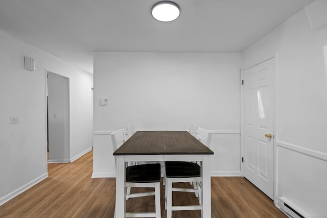 136 Pembroke Rd Unit 6-49, Danbury, CT 06811 - unfurnished dining area with baseboards, baseboard heating, and wood finished floors