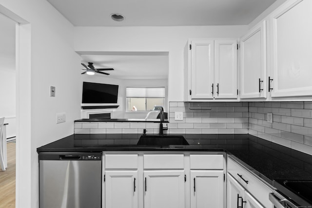 136 Pembroke Rd Unit 6-49, Danbury, CT 06811 - kitchen with dark countertops, appliances with stainless steel finishes, white cabinets, and tasteful backsplash