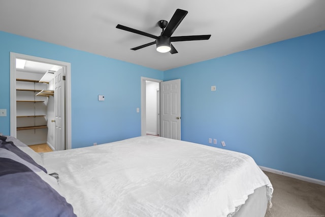 136 Pembroke Rd Unit 6-49, Danbury, CT 06811 - carpeted bedroom with a ceiling fan, baseboards, a walk in closet, and a closet