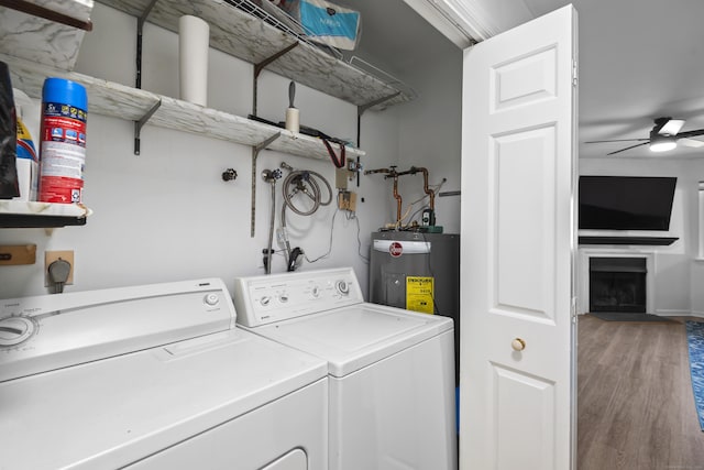 136 Pembroke Rd Unit 6-49, Danbury, CT 06811 - laundry area featuring washer and dryer, laundry area, water heater, and a fireplace