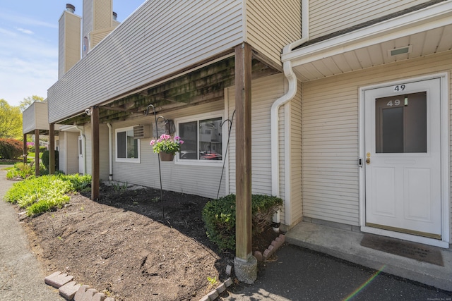 136 Pembroke Rd Unit 6-49, Danbury, CT 06811 - property entrance featuring a chimney
