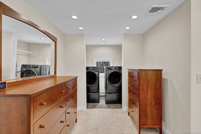 laundry room featuring separate washer and dryer, laundry area, visible vents, and recessed lighting