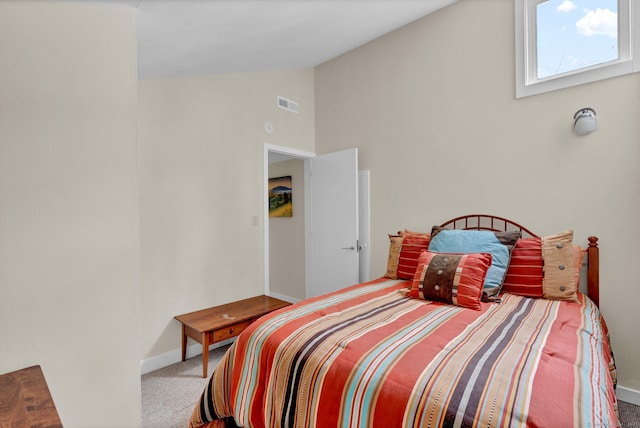 bedroom featuring high vaulted ceiling, carpet, visible vents, and baseboards