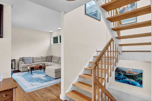 staircase featuring wood finished floors