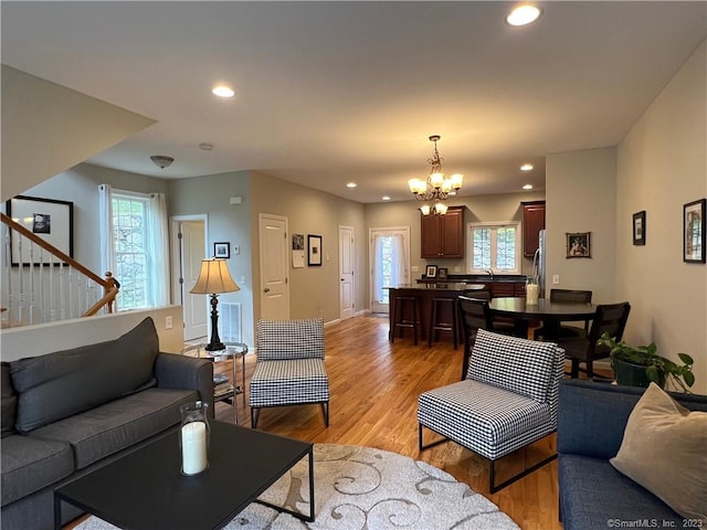 21 Old Oak Dr Unit 21, Brookfield, CT 06804 - living room with light wood-style flooring, an inviting chandelier, and recessed lighting