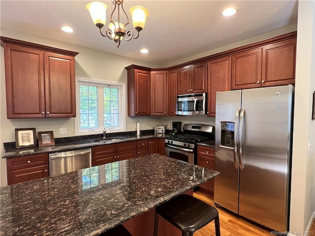 21 Old Oak Dr Unit 21, Brookfield, CT 06804 - kitchen with a sink, a kitchen bar, recessed lighting, stainless steel appliances, and pendant lighting