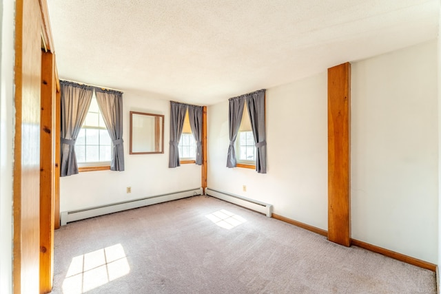 574 Fabyan Rd, Thompson, CT 06255 - carpeted spare room featuring a textured ceiling, baseboard heating, and baseboards