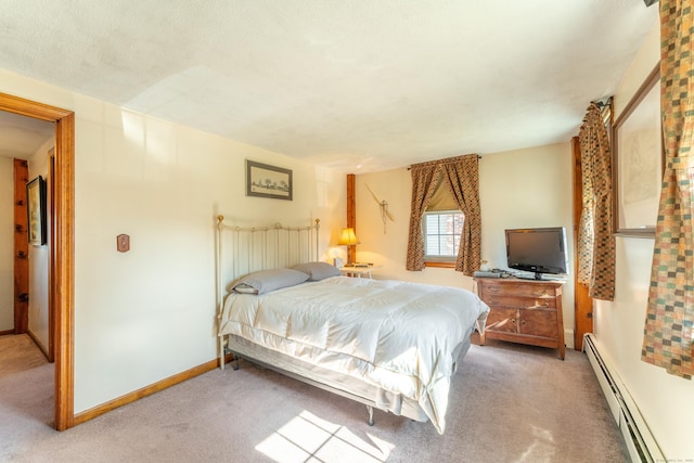 574 Fabyan Rd, Thompson, CT 06255 - bedroom with baseboard heating, baseboards, and carpet floors