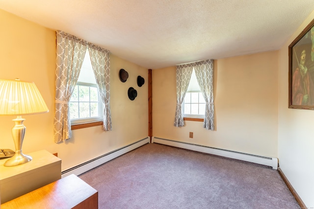 574 Fabyan Rd, Thompson, CT 06255 - empty room with a healthy amount of sunlight, carpet flooring, and a baseboard heating unit