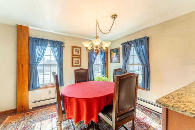 574 Fabyan Rd, Thompson, CT 06255 - dining space featuring baseboard heating, an inviting chandelier, and a healthy amount of sunlight